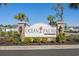 The Ocean Palms community sign has neatly trimmed bushes and a well-maintained entrance, for a welcoming first impression at 361 Rycola Circle, Myrtle Beach, SC 29575