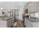 Contemporary kitchen with stainless steel appliances, gray cabinets, and a spacious granite countertop island at 361 Rycola Circle, Myrtle Beach, SC 29575