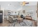 Spacious living room merges with the kitchen, showcasing a comfortable sofa and abundant natural light at 361 Rycola Circle, Myrtle Beach, SC 29575