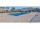 A beautiful community pool is surrounded by brick pavers and offers a refreshing escape with ample space for relaxation at 361 Rycola Circle, Myrtle Beach, SC 29575