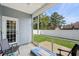 Screened porch with chairs overlooking the fenced backyard at 361 Rycola Circle, Myrtle Beach, SC 29575