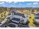 A bird's eye view of a multi-story condo building, overlooking a golf course and scenic landscape at 4827 Orchid Way # 301, Myrtle Beach, SC 29577