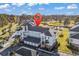 Overhead shot highlights condo residence, garages, parking, golf course, pond and surrounding landscape from an aerial perspective at 4827 Orchid Way # 301, Myrtle Beach, SC 29577