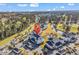 High aerial view displays community residences, a golf course, water features, pool amenities, and surrounding greenery at 4827 Orchid Way # 301, Myrtle Beach, SC 29577