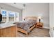 Bright bedroom featuring natural light, light-colored furniture, lamps, and hardwood floors at 4827 Orchid Way # 301, Myrtle Beach, SC 29577