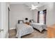 Cozy bedroom with two twin beds, ceiling fan, and light-colored walls, creating a serene atmosphere at 4827 Orchid Way # 301, Myrtle Beach, SC 29577