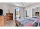 Bedroom featuring two beds, natural light, hardwood floors, and dark-colored furniture at 4827 Orchid Way # 301, Myrtle Beach, SC 29577