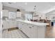 Spacious kitchen with white cabinetry, a long breakfast bar, and an open layout to the living areas at 4827 Orchid Way # 301, Myrtle Beach, SC 29577