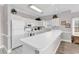 Well-lit kitchen with white cabinets and appliances, offering a clean and functional space for cooking at 4827 Orchid Way # 301, Myrtle Beach, SC 29577