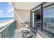 Balcony with seating, offering views of the ocean and nearby beach at 501 S Ocean Blvd. # 1002, North Myrtle Beach, SC 29582