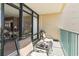 Balcony with chairs and ocean view, offering outdoor relaxation at 501 S Ocean Blvd. # 1002, North Myrtle Beach, SC 29582