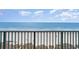 Balcony view overlooking the beach and ocean, showcasing the scenic coastal environment at 501 S Ocean Blvd. # 1002, North Myrtle Beach, SC 29582