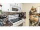 Cozy kitchen featuring modern appliances, tile backsplash, and ample counter space at 501 S Ocean Blvd. # 1002, North Myrtle Beach, SC 29582
