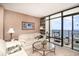Cozy living room with balcony featuring direct ocean views, comfortable seating, and modern decor at 501 S Ocean Blvd. # 1002, North Myrtle Beach, SC 29582