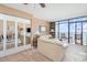 Living room with ocean views from balcony, sliding glass doors and comfortable seating at 501 S Ocean Blvd. # 1002, North Myrtle Beach, SC 29582