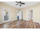 Bedroom boasting wood-look flooring with access to a bathroom and outdoor porch at 5022 Belleglen Ct. # 202, Myrtle Beach, SC 29579