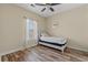Bedroom with wood-look flooring, a ceiling fan, and a twin bed at 5022 Belleglen Ct. # 202, Myrtle Beach, SC 29579