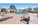 Exterior view of the community pool with lounge chairs and a clubhouse at 5022 Belleglen Ct. # 202, Myrtle Beach, SC 29579