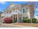 Charming condo with private balconies, lush landscaping, and traditional architectural details at 5022 Belleglen Ct. # 202, Myrtle Beach, SC 29579