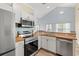 Well-lit kitchen featuring updated stainless steel appliances and durable wooden countertops at 5022 Belleglen Ct. # 202, Myrtle Beach, SC 29579