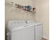 Convenient laundry room featuring modern washer and dryer, and extra storage space at 5022 Belleglen Ct. # 202, Myrtle Beach, SC 29579