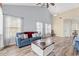 Spacious living area with vaulted ceilings, lots of natural light and durable wood flooring at 5022 Belleglen Ct. # 202, Myrtle Beach, SC 29579