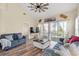 Stylish living room with vaulted ceiling, wood floors, and access to outdoor living at 5022 Belleglen Ct. # 202, Myrtle Beach, SC 29579