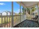 Relaxing screened porch featuring comfortable seating, a decorative rug, and views of the community at 5022 Belleglen Ct. # 202, Myrtle Beach, SC 29579