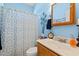 Well-lit bathroom featuring a vanity with a sink, toilet, and decorative shower curtain at 542 Sand Ridge Rd., Conway, SC 29526
