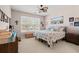Bedroom with neutral walls, carpet, ceiling fan and window overlooking the yard at 542 Sand Ridge Rd., Conway, SC 29526