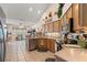 Well-equipped kitchen featuring stainless steel appliances, wooden cabinets, and tiled flooring at 542 Sand Ridge Rd., Conway, SC 29526