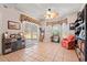 Bright living room with tile floors, ceiling fan, bay window and sliding glass door to backyard at 542 Sand Ridge Rd., Conway, SC 29526