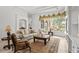 Bright living room with large windows, elegant furnishings, and neutral color palette, creating a welcoming atmosphere at 7268 Seville Dr., Myrtle Beach, SC 29572
