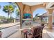 Outdoor living area featuring a fireplace, television, and a view of the pool and backyard at 7268 Seville Dr., Myrtle Beach, SC 29572