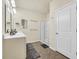 Bright bathroom with double sink vanity, shower, and tile floor at 1016 Laurens Mill Dr., Myrtle Beach, SC 29579