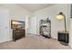 Nicely staged bedroom with a dresser with a tv, bookshelf and unique floor lamp at 1016 Laurens Mill Dr., Myrtle Beach, SC 29579