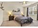 Cozy bedroom featuring a queen-size bed, soft lighting, and neutral decor at 1016 Laurens Mill Dr., Myrtle Beach, SC 29579