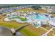 Stunning aerial view of the resort style community pool with lazy river and lounging areas at 1016 Laurens Mill Dr., Myrtle Beach, SC 29579