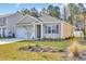 Charming single-story home with a manicured lawn and colorful landscaping at 1016 Laurens Mill Dr., Myrtle Beach, SC 29579