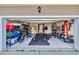 Spacious and organized garage featuring an impressive home gym setup at 1016 Laurens Mill Dr., Myrtle Beach, SC 29579
