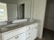 Bathroom with double vanity and a view into the bedroom at 1025 Jase Dr., Longs, SC 29568