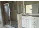 Bright bathroom featuring a tiled shower and white vanity at 1025 Jase Dr., Longs, SC 29568