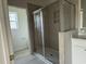 Modern bathroom with a glass-enclosed shower and tiled walls at 1025 Jase Dr., Longs, SC 29568