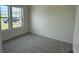 Cozy bedroom featuring carpet flooring and a large window providing natural light at 1025 Jase Dr., Longs, SC 29568