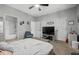 Bright bedroom featuring a ceiling fan and large TV, providing a modern and comfortable space for relaxation and entertainment at 111 Maddux Ln. # B, Myrtle Beach, SC 29588