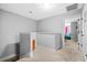 Neutral hallway with an orange cabinet and an open bedroom at the end at 111 Maddux Ln. # B, Myrtle Beach, SC 29588