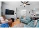 Spacious living room with comfortable seating, hardwood floors, a ceiling fan, and open access to other areas at 111 Maddux Ln. # B, Myrtle Beach, SC 29588
