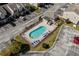 Community pool with lounge chairs and parking in aerial view at 111 Maddux Ln. # B, Myrtle Beach, SC 29588