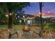 Cozy backyard with fire pit and chairs, perfect for outdoor gatherings at 160 Shipmaster Ave., Pawleys Island, SC 29585