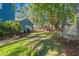 Green backyard with lawn and hammock, plus patio and grill at 160 Shipmaster Ave., Pawleys Island, SC 29585
